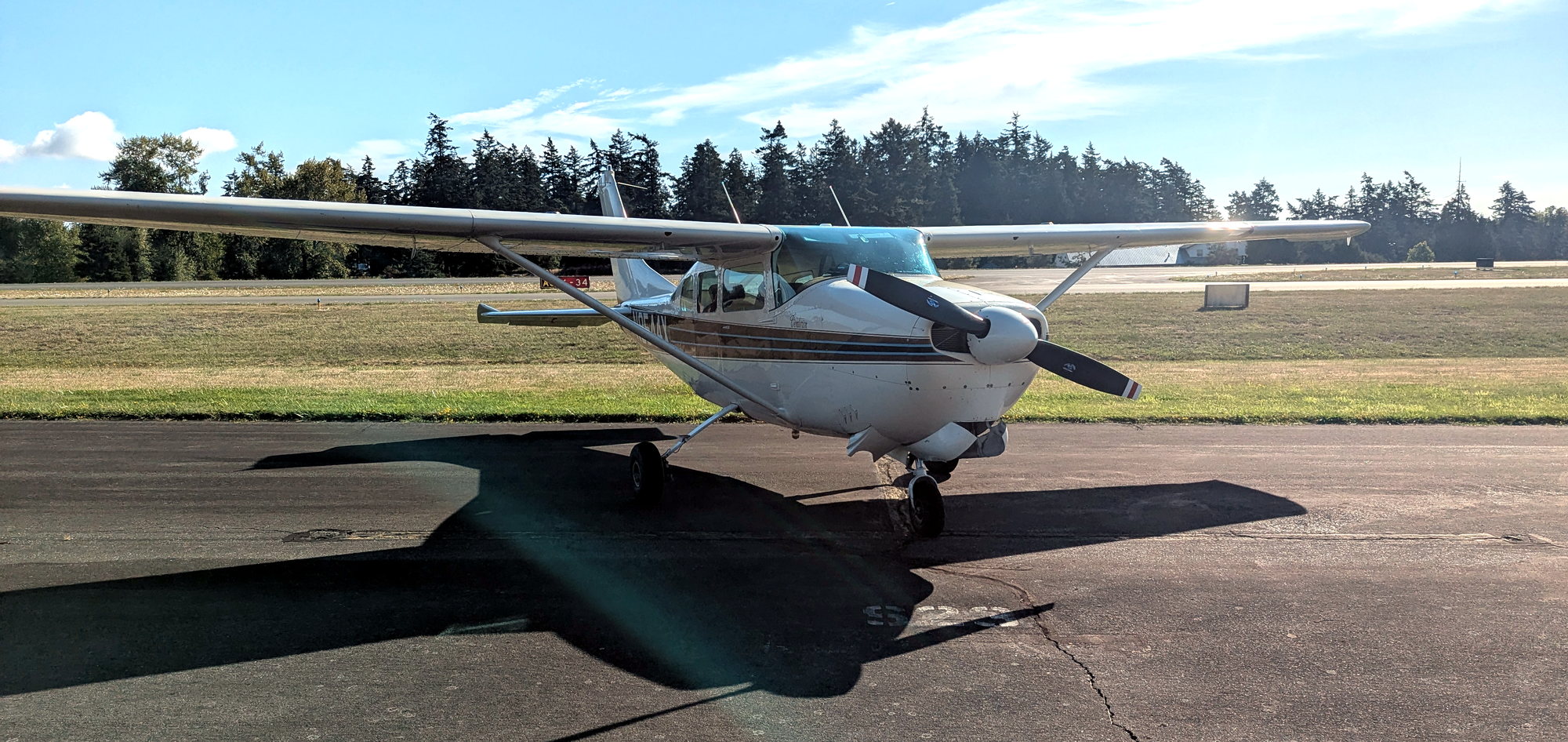 Side view of B&B Aviation's Cessna 210B N9544X on the Arlington airport ramp